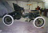 1904 Olds Runabout, closeup of wheel is a few rows down 